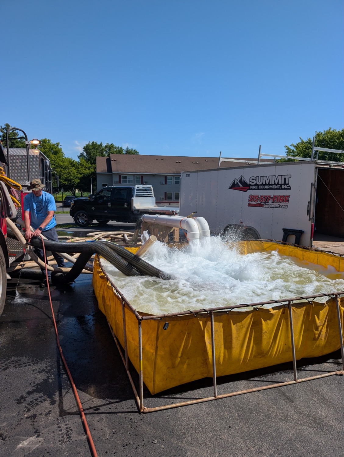Summit Fire Equipment trailer and portable tank supporting an on-site pump performance test